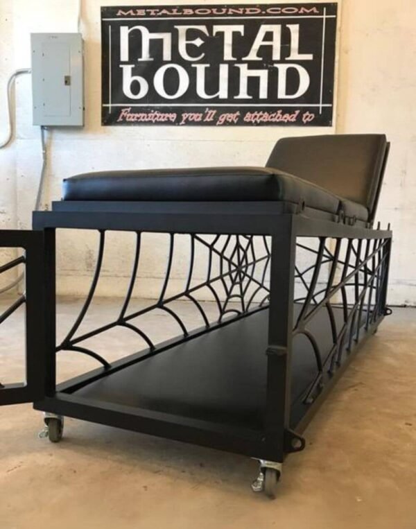 Spider Table Cage by Metalbound: a versatile metal table with a built-in cage featuring a spiderweb design, designed for secure and immersive bondage play.