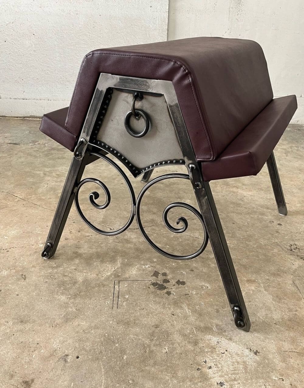 Scroll Bench by Metalbound with intricate hand-crafted steel scrolls and durable construction for versatile BDSM play.