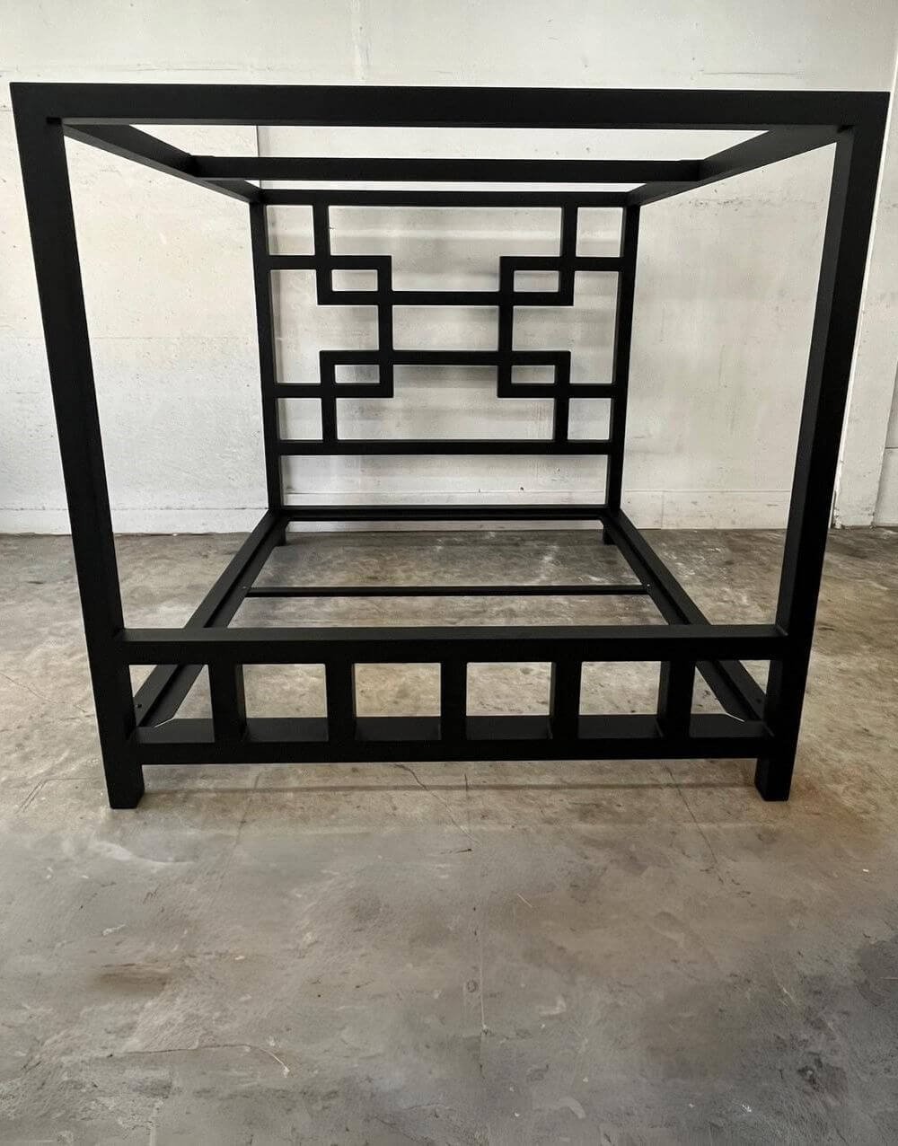The East Meets West Bed by Metalbound: a stylish metal bed frame inspired by Eastern and Western design elements, featuring multiple attachment points for versatile bondage and restraint play.