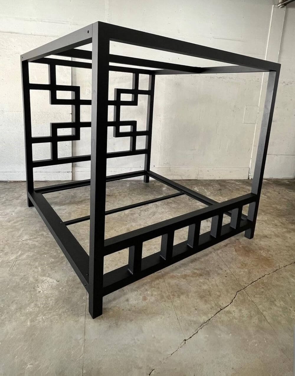 The East Meets West Bed by Metalbound: a stylish metal bed frame inspired by Eastern and Western design elements, featuring multiple attachment points for versatile bondage and restraint play.