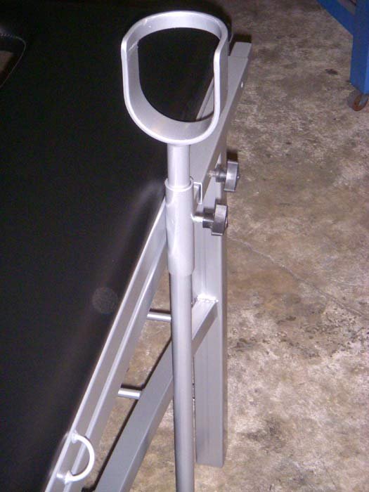 Aluminum Table with Removable Stirrups in Black by Metalbound: a durable, black-finished aluminum table featuring detachable stirrups, designed for secure and versatile bondage play. Closeup of stirrup.