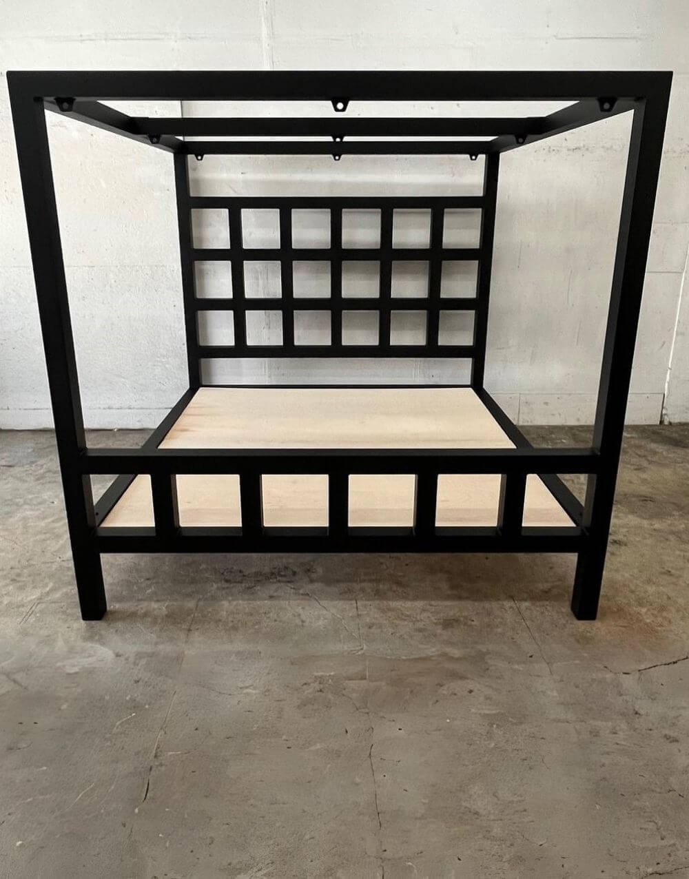 The Window Pain Bed by Metalbound: a striking metal bed frame with a unique window pane design, featuring multiple attachment points for diverse and secure bondage play.