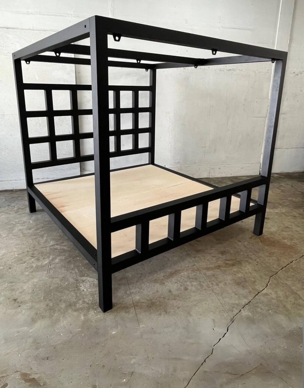 The Window Pain Bed by Metalbound: a striking metal bed frame with a unique window pane design, featuring multiple attachment points for diverse and secure bondage play.