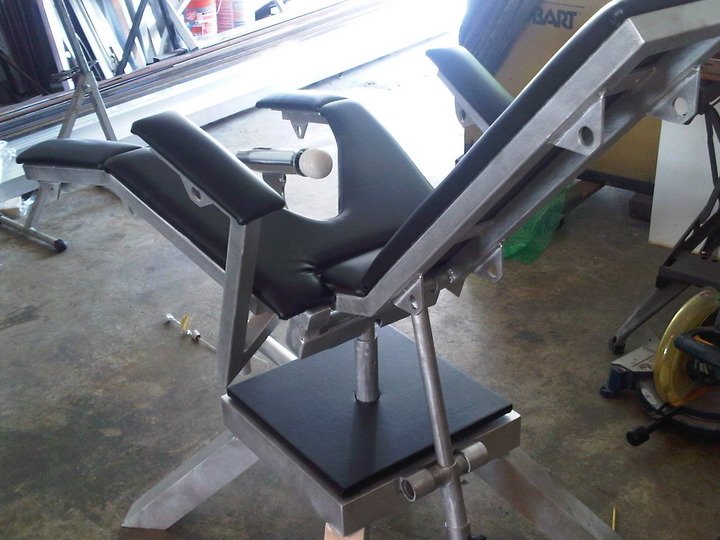 Birthing Chair with Arms and Integrated Wand Vibrator Holder by Metalbound: a versatile and supportive chair designed for comfortable and secure bondage play, featuring built-in wand vibrator holder for enhanced sensory stimulation.
