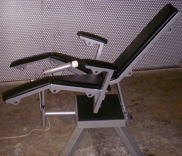 Birthing Chair with Arms and Integrated Wand Vibrator Holder by Metalbound: a versatile and supportive chair designed for comfortable and secure bondage play, featuring built-in wand vibrator holder for enhanced sensory stimulation.