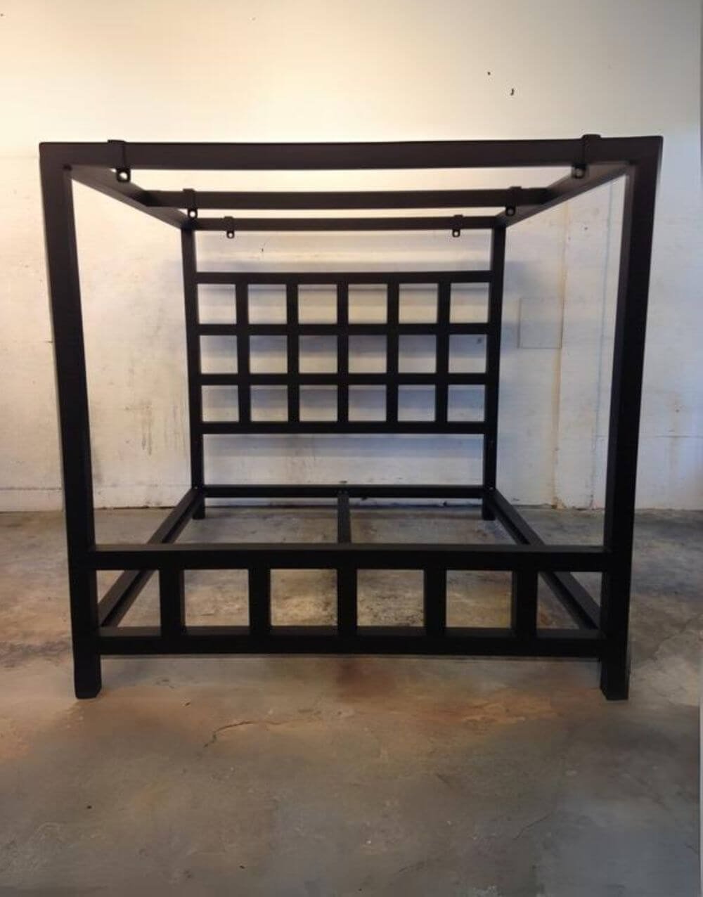 The Window Pain Bed by Metalbound: a striking metal bed frame with a unique window pane design, featuring multiple attachment points for diverse and secure bondage play.