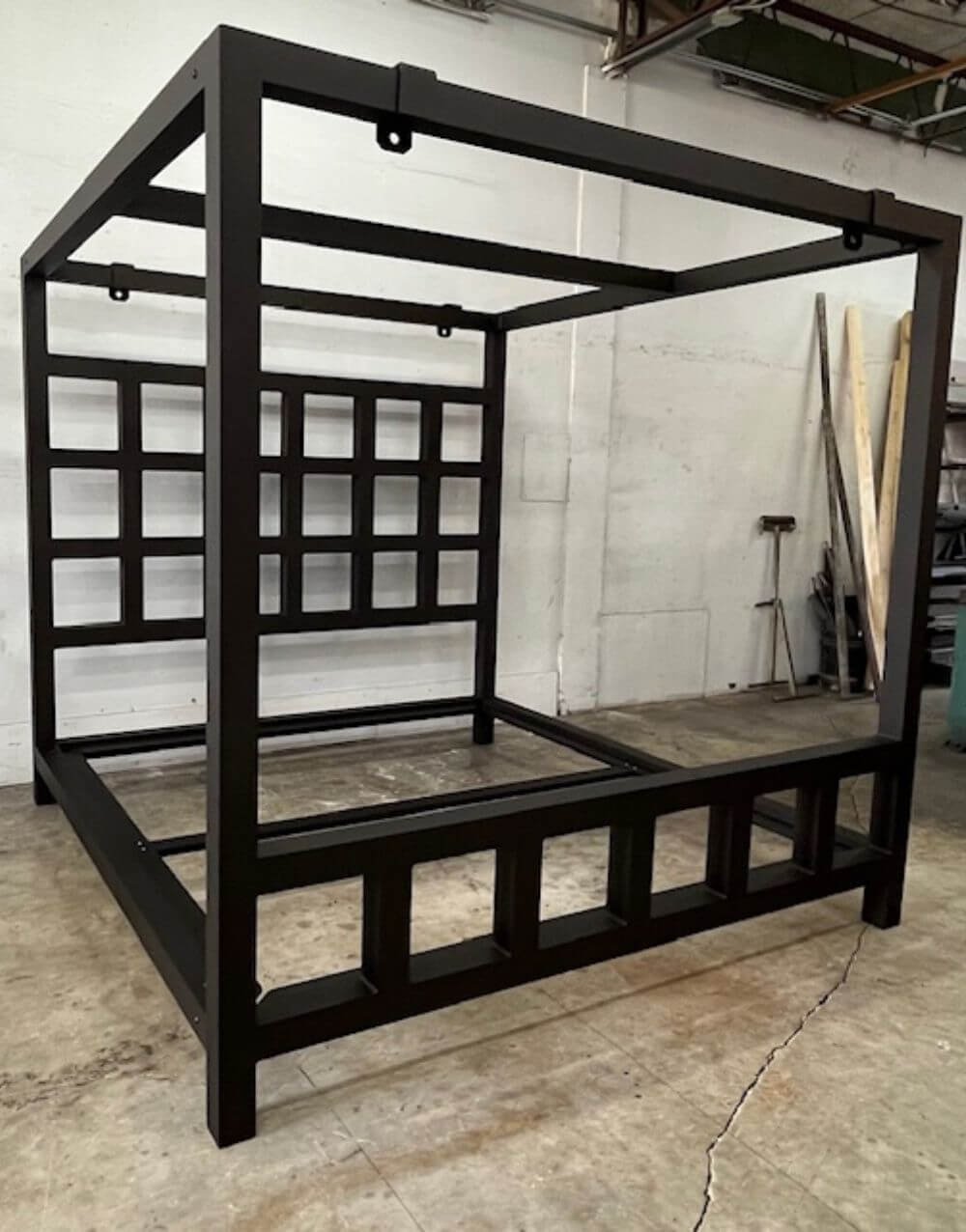 The Window Pain Bed by Metalbound: a striking metal bed frame with a unique window pane design, featuring multiple attachment points for diverse and secure bondage play.