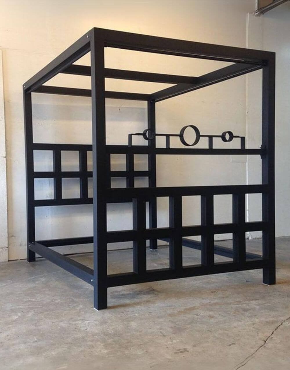 The Window Pain Bed by Metalbound: a striking metal bed frame with a unique window pane design, featuring multiple attachment points for diverse and secure bondage play.