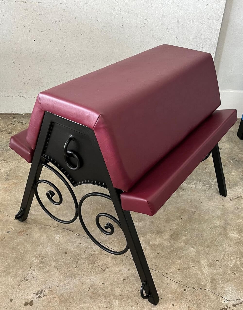 Scroll Bench by Metalbound with intricate hand-crafted steel scrolls and durable construction for versatile BDSM play.