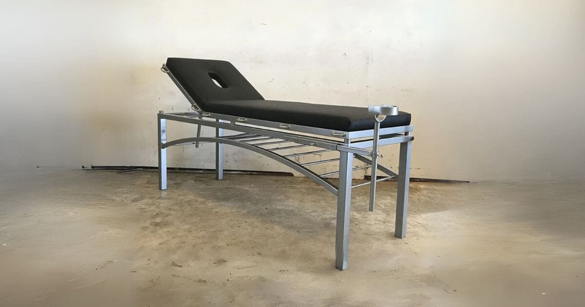 The adjustable bondage table.